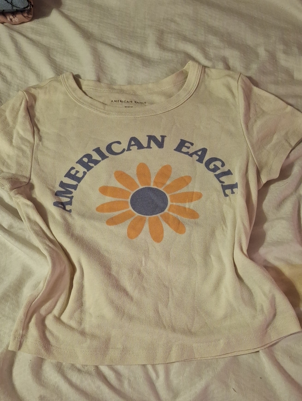 American Eagle Cream Logo Tee with Subtle Black Print